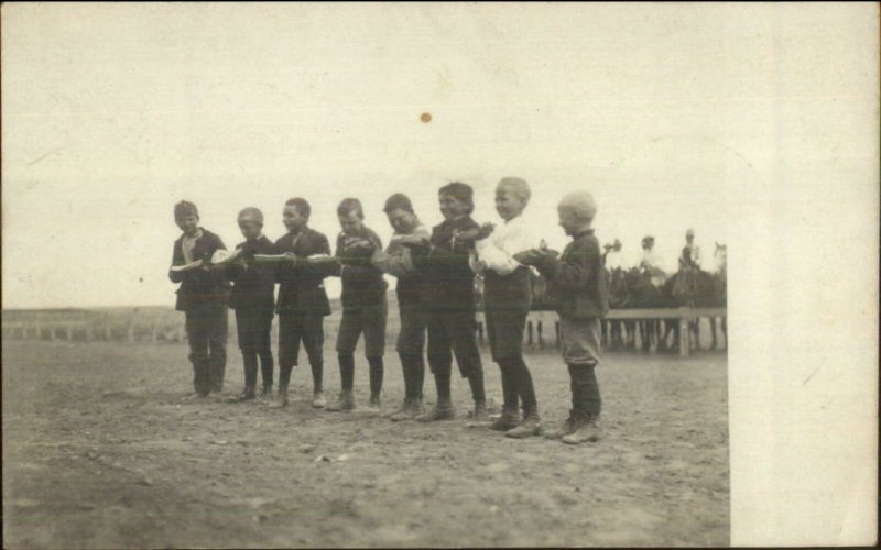 Rawlins WY 1907 Cancel - Boys in Pie Eating Contest Rreal Photo Postcard