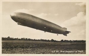 Graf Zeppelin in flight real photo postcard