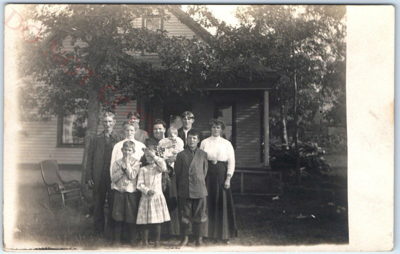 c1910s Sun-Squinting Family by House RPPC Outdoor Men Women Cute Real Photo A142