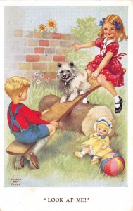 US32 artist signed Gladys Ann Birch seesaw children playing with dog doll ball