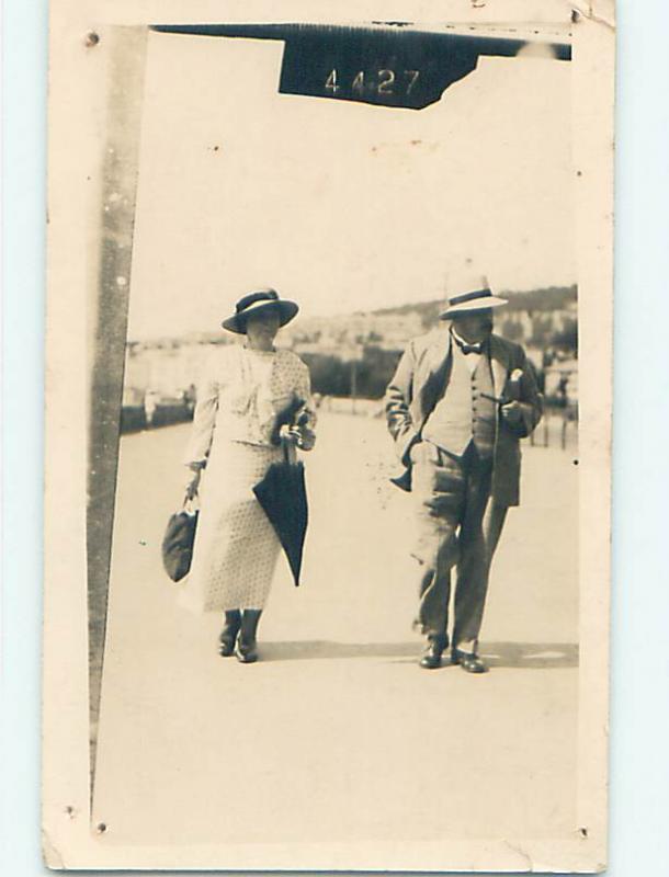 c1910 RPPC - FASHION - WOMAN WITH PURSE & UMBRELLA IN WESTON-SUPER-MARE UK j6180
