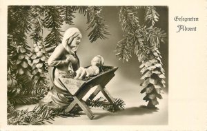 Advent greetings postcard Holy Family statuette pine cones