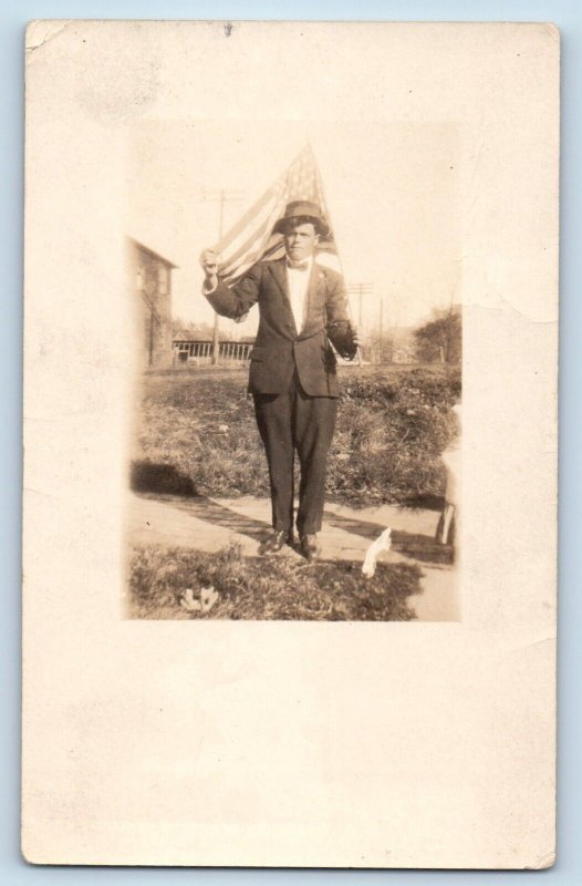 c1910's Postcard RPPC Photo Man Holding Flag Scene Field Unposted Antique