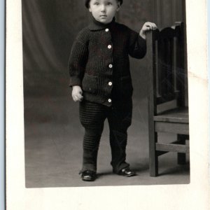 c1910s Cute Stoic Little Boy RPPC Stocking Cap Black Wool Sweater Photo Vtg A192