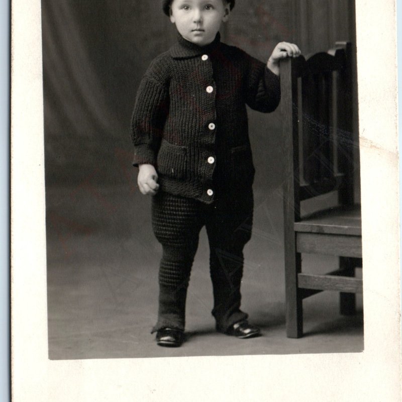 c1910s Cute Stoic Little Boy RPPC Stocking Cap Black Wool Sweater Photo Vtg A192