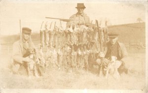 H74/ Interesting RPPC Postcard c1910 Men Rabbit Hunting Rifles Dogs 206