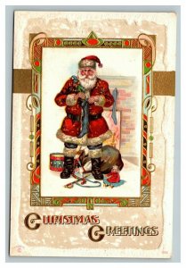 Vintage 1910's Christmas Postcard Santa Claus with Toys Filling Stockings
