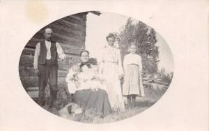 MULTI GENERATIONS + DOG~LOG CABIN~OVAL REAL PHOTO POSTCARD 1910s~MOST LIKELY MN