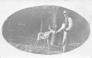 J6/ Interesting RPPC Postcard c1910 Man Hand-Feeding Deer Buck 49