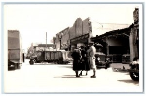 US Marine Guarding Postcard RPPC Photo Collapsed Building Drugs Store c1930's