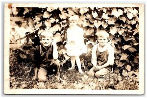 RPPC Children in Bushes Boys Overalls All Smiles Sweet Little Girl Postcard B27