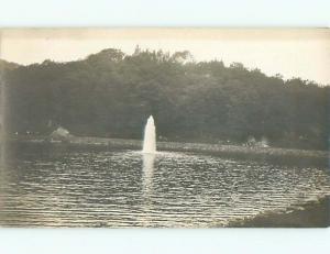 Pre-1917 rppc WATER FOUNTAIN SHOOTS UP IN MIDDLE OF POND o2347