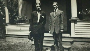 1909 RPPC Postcard 2 Men in front of House Porch RPO Cancel Cheyenne & Denver