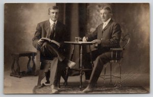 RPPC Two Handsome Men Book Table Little Falls MN To Borrby Sweden Postcard B32