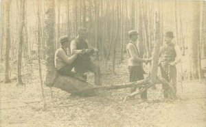 C-1905 Men in Woods reading boxes RPPC Photo Postcard 20-10925
