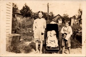 Real Photo Postcard Three Children Outside of a House