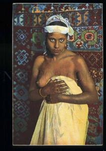 213636 Semi-nude Arabian girl in HAREM carpet Vintage postcard