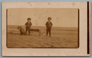 Postcard RPPC c1910s Two Children In Outfits With Toy Wagon And A Dog