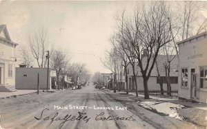 J24/ Lafayette Colorado RPPC Postcard c1922 Main Street Stores Homes 296