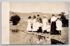 RPPC Beautiful Edwardian Family Dresses Hats Children at Duck Pond Postcard C23