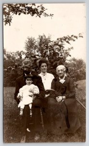 RPPC Granny and Family in Yard Darling Child Real Photo Postcard L44