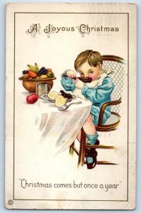 c1910's Christmas Boy Eating Fruits Embossed Somerville Massachusetts Postcard
