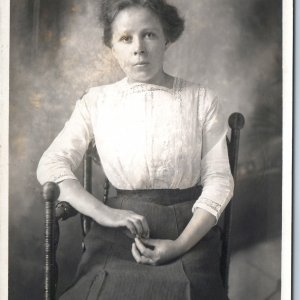 c1910s Cute Young Lady in a Chair Portrait RPPC Serious Woman Real Photo PC A212