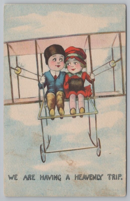 Greetings~Boy & Girl In Biplane~Heavenly Trip~Vintage Postcard