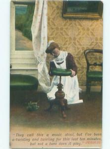 Bamforth Comic WOMAN WITH MUSIC STOOL AB9814