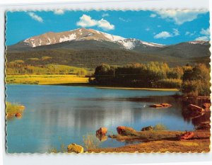 Postcard Snow thatched peak reflected in a placid lake, Colorado