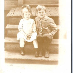 ID'd c1910s Cute Children on Porch RPPC Boy Girl Real Photo Postcard Nieman A123