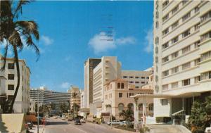 MIAMI BEACH FLORIDA LOOKING NORTH ON COLLINS AVENUE POSTCARD 1957