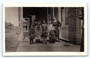 RPPC BOISE?,ID Idaho ~ GROUP of CUTE KIDS on SIDEWALK c1910s Postcard