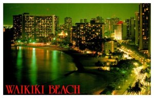 Evening view of the beautiful hotels lining Waikiki Hawaii Postcard Posted 1984