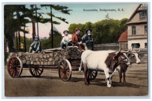 c1910 Four Men Riding Oxomobile Bridgewater Nova Scotia Canada Postcard