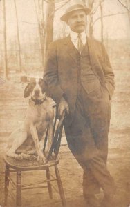 RPPC WELL DRESSED MAN WITH HIS DOG AL McCORMICK REAL PHOTO POSTCARD  (c. 1910)
