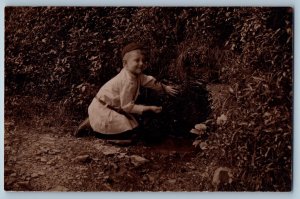 c1905 Little Boy Exploring Animal Den RPPC Photo Unposted Antique Postcard