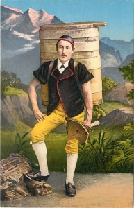 Vintage Postcard Man in Swiss Ethnic Costume Carrying Seat & Barrel on His Back