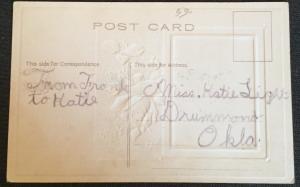 Postcard Unused w/Writing on back “Best Wishes” Embossed Flowers/House LB