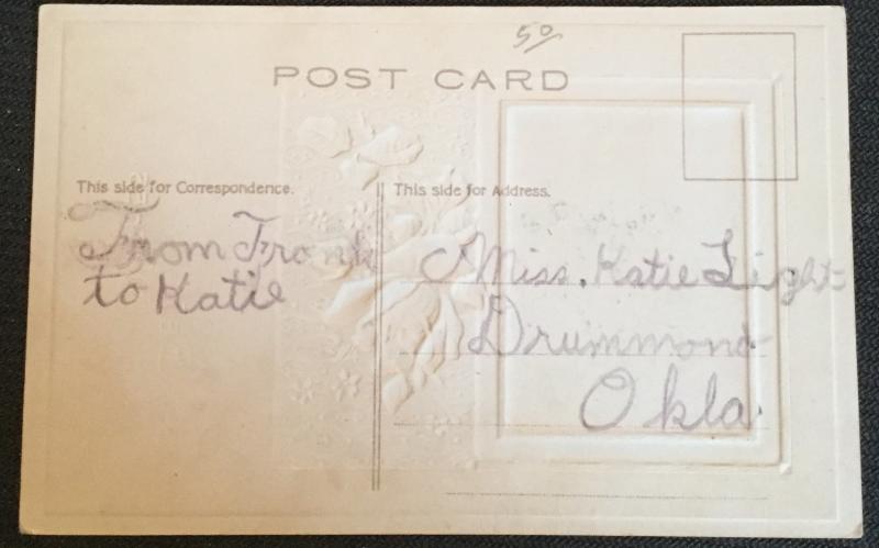 Postcard Unused w/Writing on back “Best Wishes” Embossed Flowers/House LB