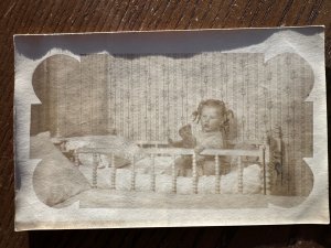 RPPC-EARLY Antique REAL PHOTO Postcard Girl In Crib