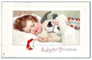 c1910's Joyful Christmas Little Boy Sleeping With Toys Embossed Antique Postcard