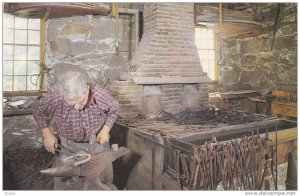 Hammering out a red-hot horseshoe,Moses Wilder Blacksmith Shop,Old Sturbride,...