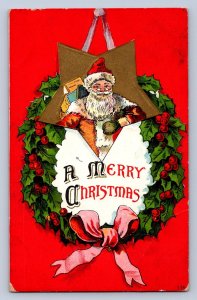 K9/ Santa Claus Christmas Postcard c1910 Smile Toys Wreath 39