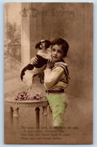 c1910's Christmas Boy Hugging Dog Pink Flowers Posted Antique Postcard