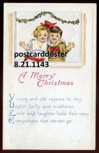 h5210 - CHRISTMAS Postcard 1920s Embossed. Smiling Kids. Mistletoe