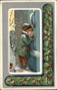 Christmas Little Boy Knocks on Door in Snow Holly Border c1910 Postcard