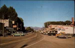 Ennis Montana MT 1960s Street Scene Classic Cars Trucks Vintage Postcard