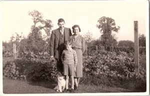 RPPC Family & Dog Garden Cute Terrier Christmas Message 1940s/50s