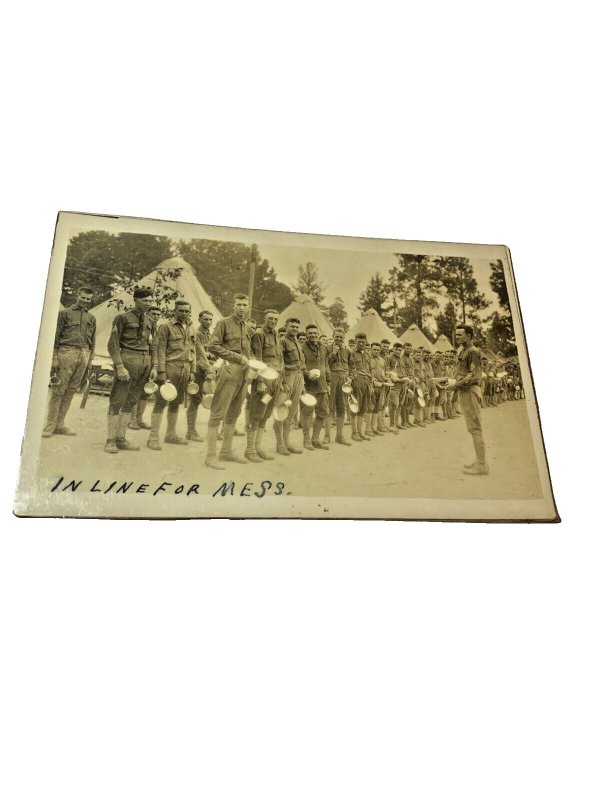 Postcard RPPC View of Soldiers in line for Mess with Tents in background.   L5